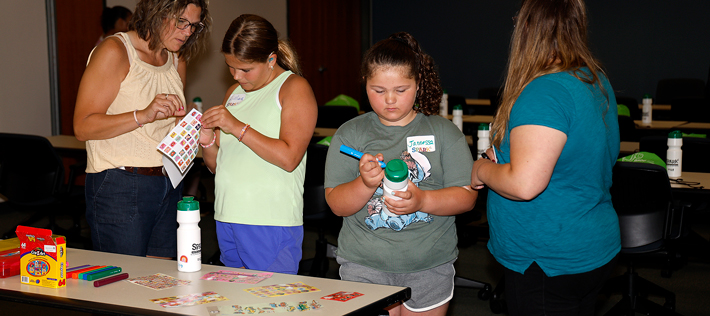 Girls participating in crafts