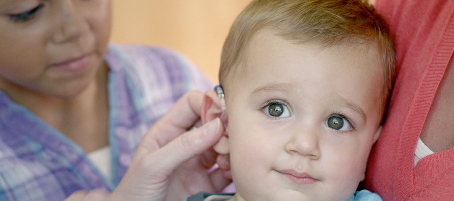 Baby with hearing aid
