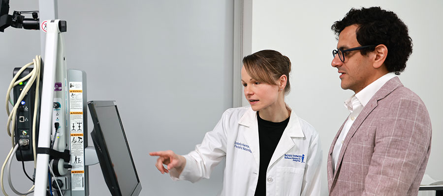 Doctors looking at a monitor