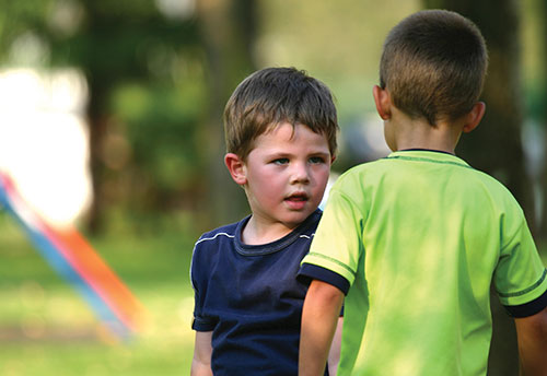 children arguing in playground