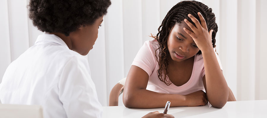 Psychiatrist talking with child